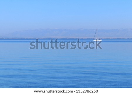 Sailing boat on calm sea