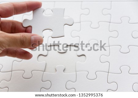 Fill in the last piece of the jigsaw puzzle Royalty-Free Stock Photo #1352995376