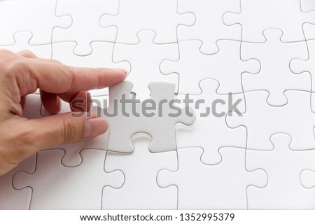 Fill in the last piece of the jigsaw puzzle Royalty-Free Stock Photo #1352995379