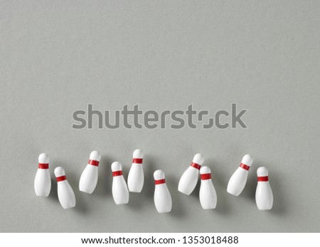 bowling pins on grey background, top view