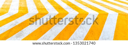 Asphalt road background with white- Yellow chevron seamless pattern sign for warning. 