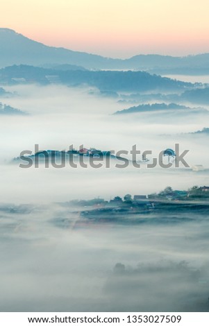 Aerial view of Highway 27c or Provincial Route 723 from Da Lat city to Nha Trang city, at Dasar valley, in the cloud and fog. Lam Dong, Vietnam