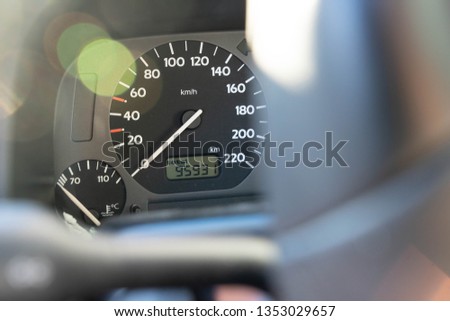 Tachometer of a car seen through a steering wheel Royalty-Free Stock Photo #1353029657