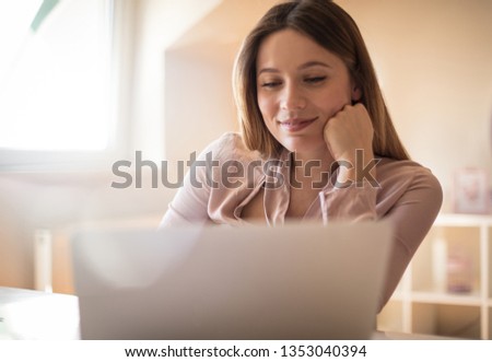 Watch the inflow of money, because success is worth it. Business woman using laptop.