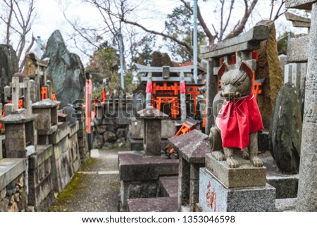 Fox altar and Torii Gates in Fushimi Inari-taisha shrine, Kyoto, Japan