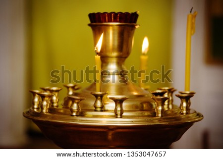 lighting fire candles in russian orthodox church