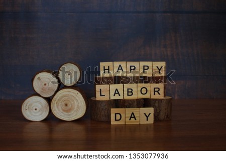 Labor day conceptual photo: Wooden blocks arranged with words/wishes "Happy Labor Day"