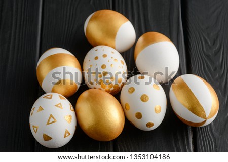 Hand-painted eggs on black background