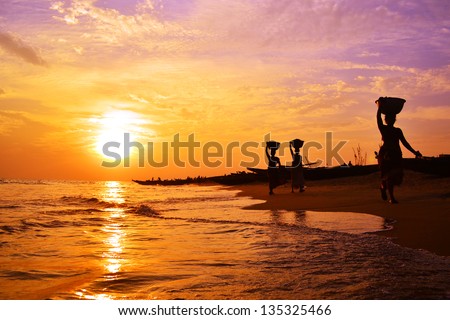 Indian women carrying baskets Royalty-Free Stock Photo #135325466