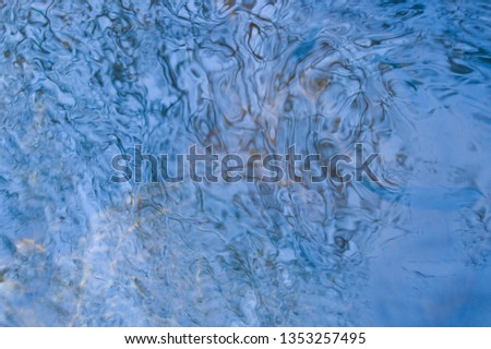 Blue sea flowing water surface with waves
