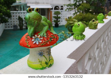 the frong doll decorated in the garden
