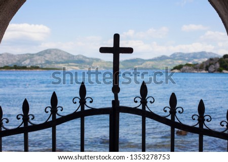 Cross on a fence