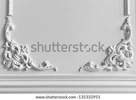 Beautiful ornate white decorative plaster moldings in studio Royalty-Free Stock Photo #135332951