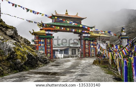 Tawang, Arunachal Pradesh, India. Buddhist and tribal architecture as seen in this colourful gateway to Tawang at Sela Pass 13,700 ft above sea level in western Arunachal Pradesh on a misty morning. Royalty-Free Stock Photo #135333140