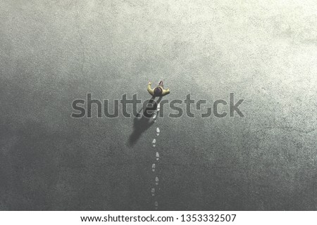 man walking in the streets leaving footsteps on the ground Royalty-Free Stock Photo #1353332507