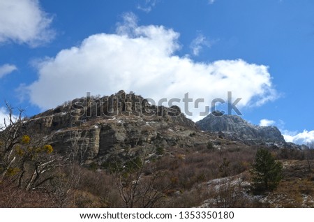Beautiful panorama of mountain in green forest over blue sky