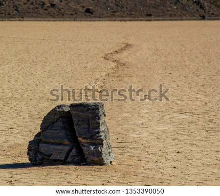 Moving Stones at the Playa Racetrack in Death Valley California with a depth of field