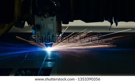Industrial Laser cutting processing manufacture technology of flat sheet metal steel material with sparks laser cut metal splashes