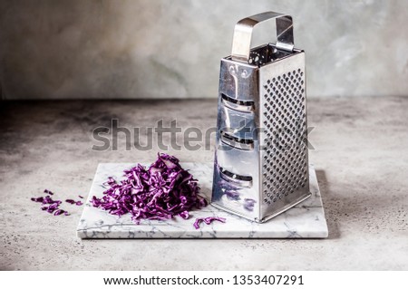 Grating Red Cabbage on a Marble Board, copy space for your text