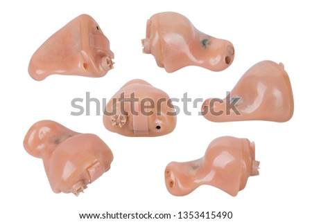 Small modern hearing aids on white background isolated, alternative to surgery