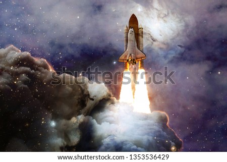 Space shuttle taking off on a mission. Deep space. Beauty of endless universe. Elements of this image furnished by NASA Royalty-Free Stock Photo #1353536429