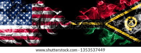 United States of America vs Vanuatu smoky mystic flags placed side by side. Thick colored silky smoke flags of America and Vanuatu.