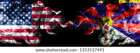 United States of America vs Tibet, Tibetan smoky mystic flags placed side by side. Thick colored silky smoke flags of America and Tibet, Tibetan.