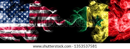 United States of America vs Senegal, Senegalese smoky mystic flags placed side by side. Thick colored silky smoke flags of America and Senegal, Senegalese.