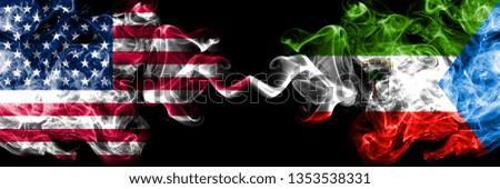 United States of America vs Equatorial Guinea smoky mystic flags placed side by side. Thick colored silky smoke flags of America and Equatorial Guinea.