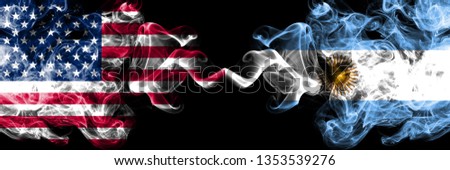 United States of America vs Argentina, Argentinian smoky mystic flags placed side by side. Thick colored silky smoke flags of America and Argentina, Argentinian.
