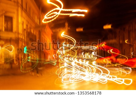 creative photography with unusual pattern of dancing light or neon in chaotic multi colored lines on abstract background. concept of unique desktop wallpaper or screensaver. copy space, texture, blur