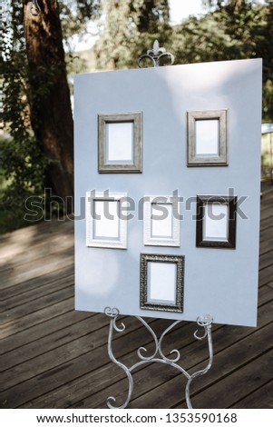 Wedding seating chart on wooden boards, outdoors