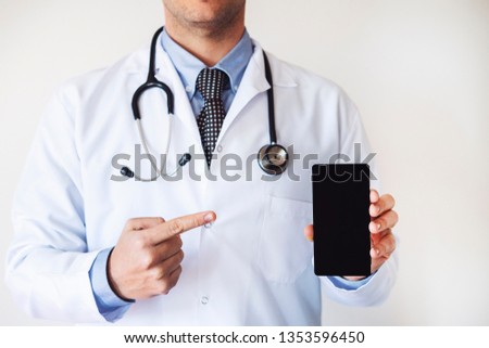 Doctor holding mobile phone , E-Health concept, Health concept, white screen, show someting