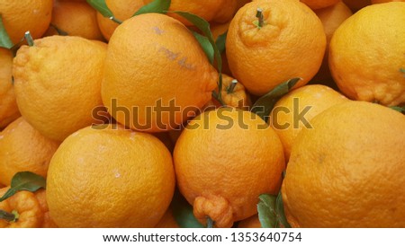 Healthy, fresh organic oranges in supermarket for sale, pile of orange in market for texture
