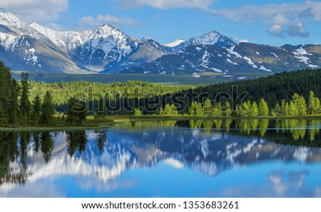 Wild mountain lake in the Altay mountains. Summer landscape, beautiful reflection. Travels in Russia. Royalty-Free Stock Photo #1353683261