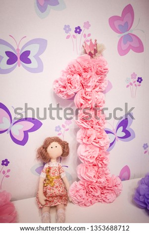 The numeral one and the doll from fabric doll Tilda
