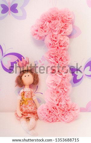 The numeral one and the doll from fabric doll Tilda