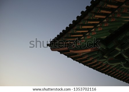 What a beautiful traditional eaves! This picture shows appearance of Korea's traditional architecture with blue sky. You can enjoy the pattern of eaves.