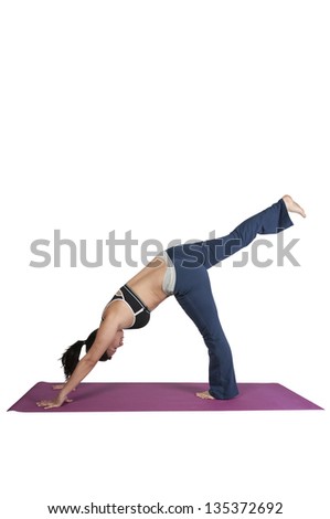 Beautiful Asian woman doing her Yoga exercises