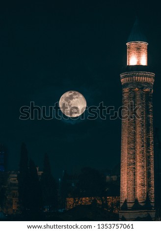 full moon and minaret view of the antalya city at night