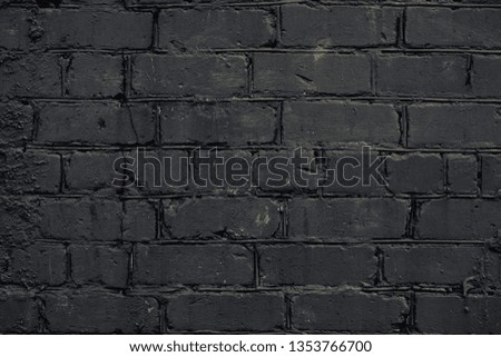 
Texture of black brick wall background. Retro abstract closeup of grunge texture dark gray brick wall. Black stone dilapidated background. Dark grey shabby blank space architecture.  