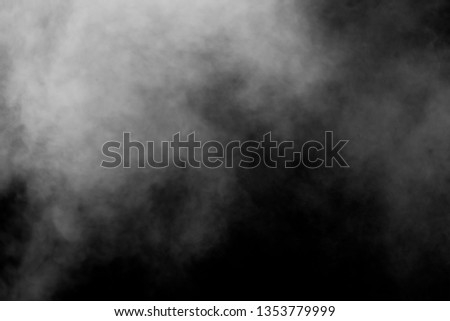 Isolated white fog on the black background, smoky effect for photos and artworks. Smoke and powder overlay on black background