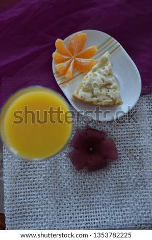 Abstract breakfast. Health food. Orange juice, cheesecake, mandarin, cactus flower