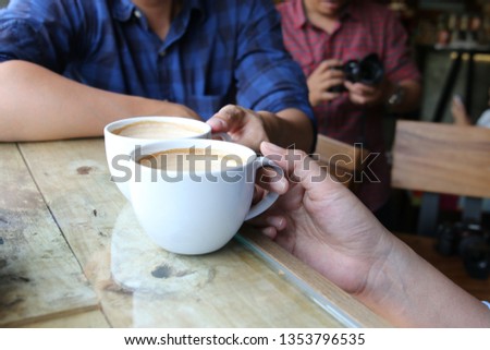 Take two cups of coffee for meeting, In coffee shop