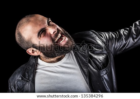 a masculine bearded man isolated over a black background