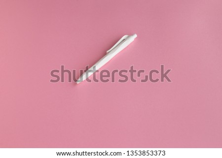 white pen on a pink background in the center, space for text