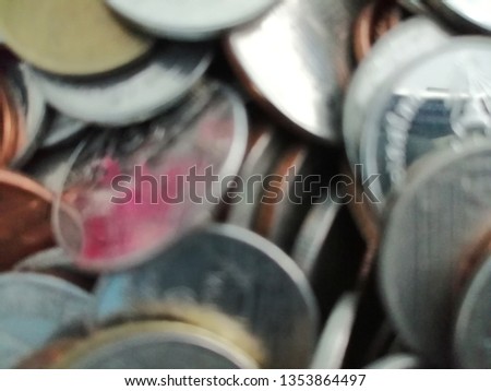 Blurred photo of a pile of Thai coins for business and finance background.