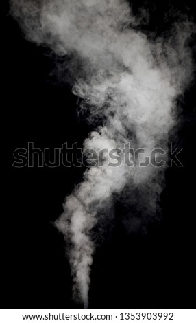 white smoke or fog blow to up against black background 