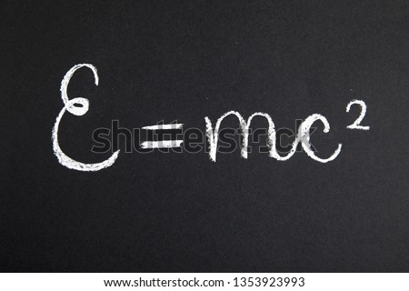 Formula E=mc2 On Chalkboard Royalty-Free Stock Photo #1353923993