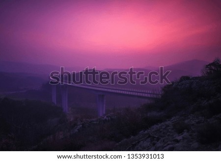 colorful sunset above the highway viaduct